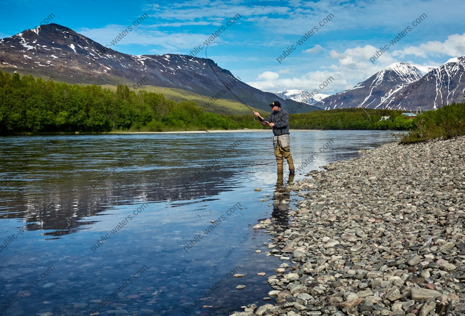 man fishing on the river
