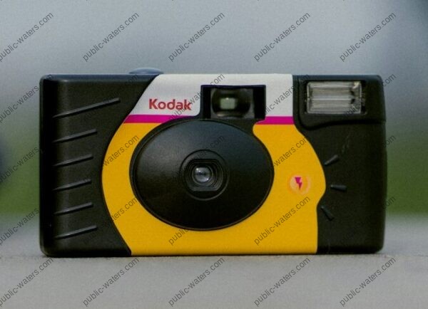 selective focus photograph of black and yellow Kodak camera